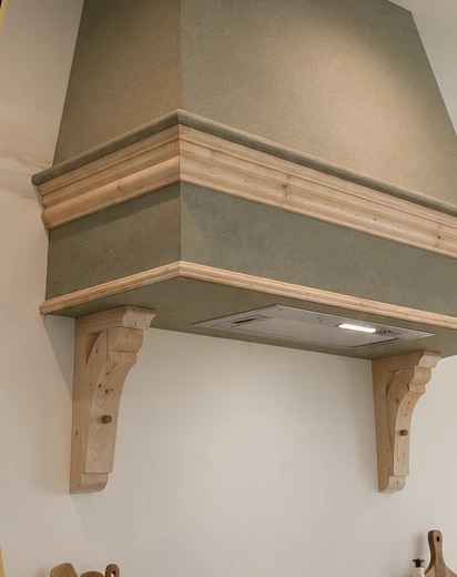 Traditional cooker hood with timber corbels